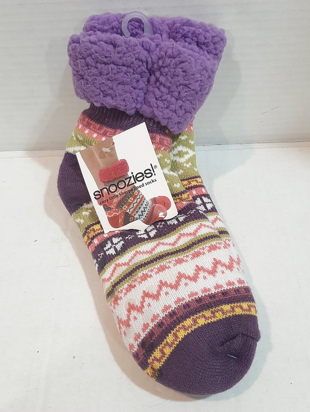 pair of purple and multi-colored patterned snoozies! cozy